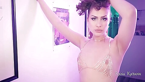 Trans girl in black shorts on her knees gets masturbated