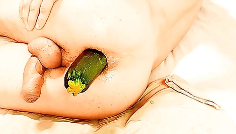 Amateur woman in a trance mode is getting stuffed with a zucchini